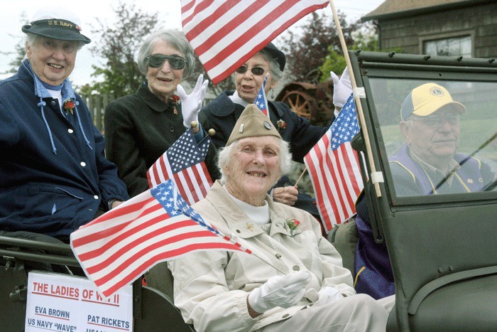 The Ladies of World War II drive in a vintage Jeep during Coupeville’s annual Memorial Day parade to honor veterans. In the front seat is Pat Ricketts and in the back
