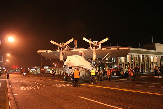 A crew slowly moves the PBY-5A Catalina to its new home across from the PBY-Naval Air Museum on Pioneer Way.