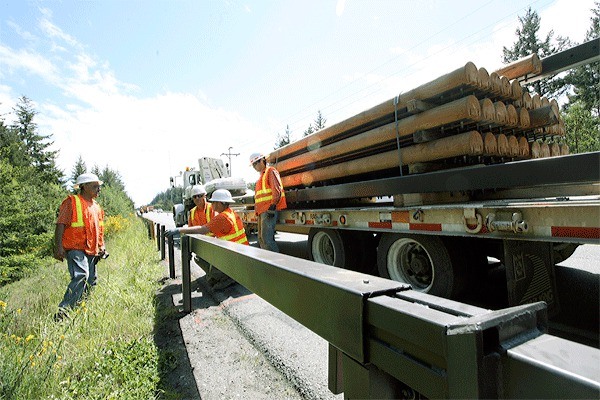 Work crews are busy installing pricey new wood guardrails on a stretch of Highway 20 located inside Ebey’s Landing National Historical Reserve. Motorists can expect delays on Highway 20 due to a single-lane closure through Thursday.