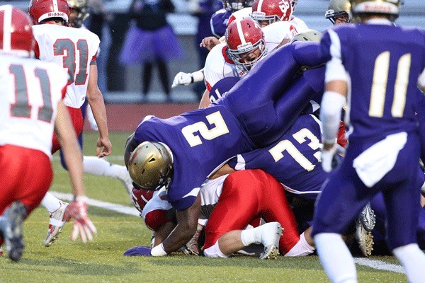 Princeton Lollar (2) dives into the end zone for one of his five touchdowns Friday. Lollar set a school career rushing record in the game.