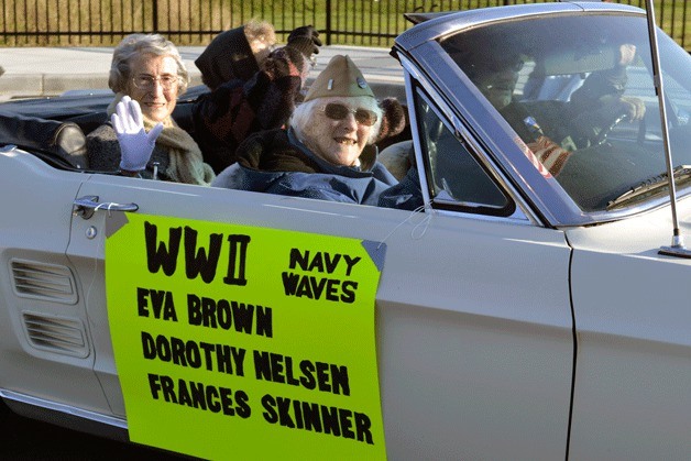 Women veterans of World War II wave at spectators during the first Veterans Day parade Saturday in Oak Harbor.