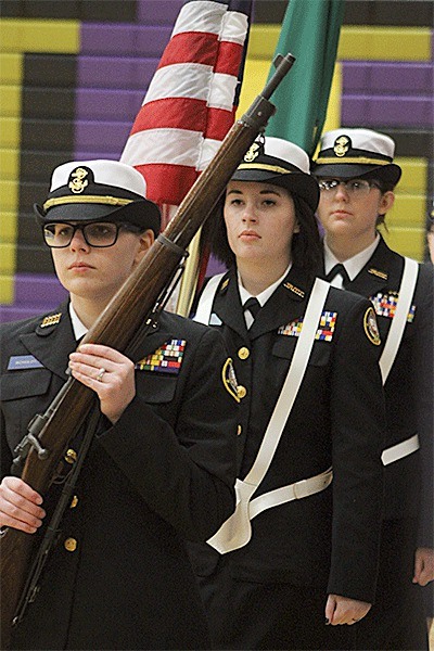 Members of the OHHS color guard No. 2 march Saturday during their first-place performance. From the left are Natalie Schuldt
