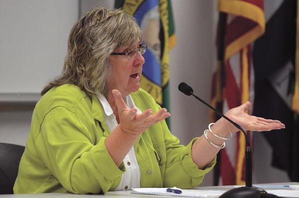Island County Human Services Director Jackie Henderson addresses the Board of Commissioners Monday concerning an ongoing discussion about the county’s drug and alcohol treatment provider. The board voted to seek proposals for a replacement in the private sector.