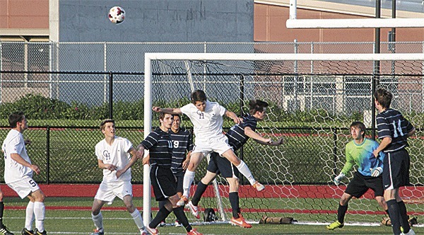 Oak Harbor's J.J. Mitchell (center