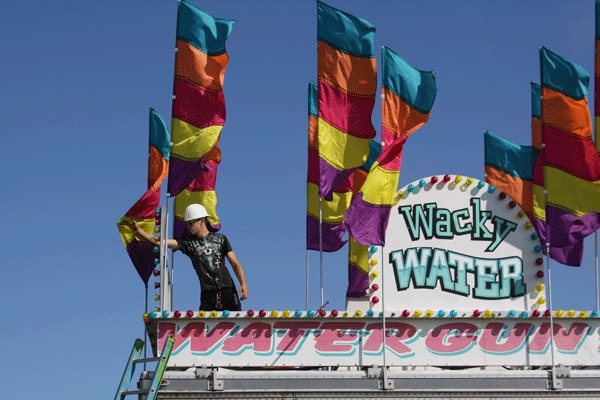 A worker takes part in the carnival setup Tuesday