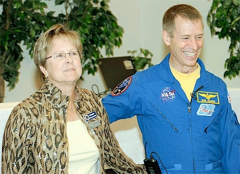 Oak Harbor city Councilwoman Beth Munns takes a moment to greet Atlantis Shuttle pilot Greg Johnson.