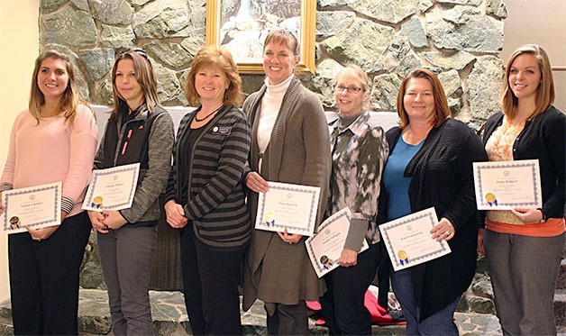 Oak Harbor Elementary Principal Dorothy Day recognizes nine teachers for their work with struggling learners. Left to right are Nicole Cheshier