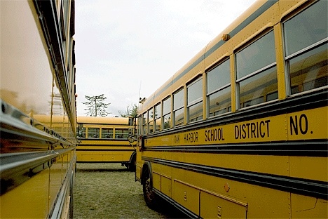 Eight renegade bus drivers having a good time parked their rigs on the grass adjacent to the old football field off Whidbey Avenue Thursday afternoon.