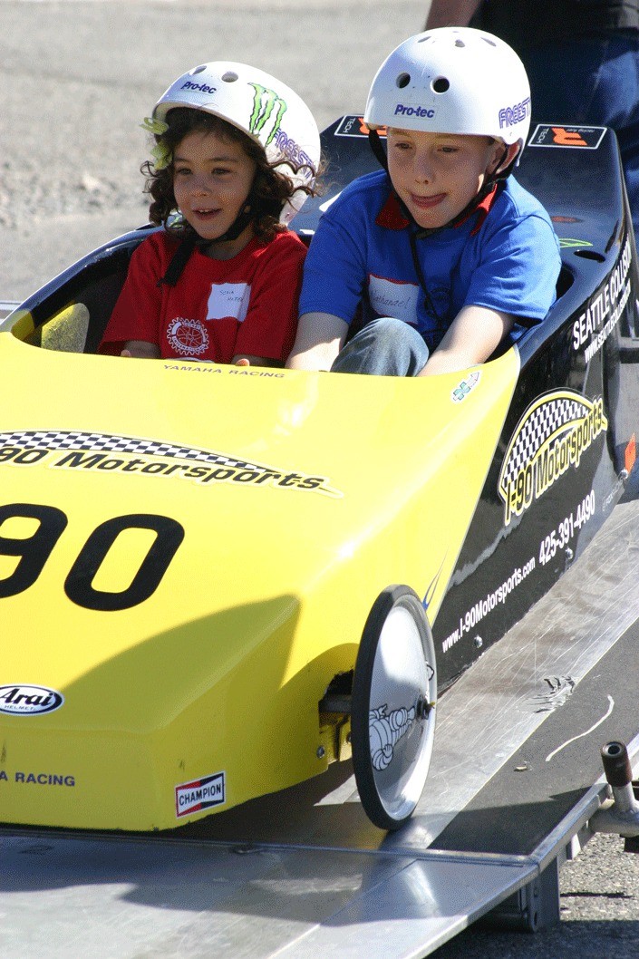 Sofia Mottern and Nathanael Thompson are among the excited racers who rolled down Barrington Hill in the Challenge Series soapbox derby race Saturday.