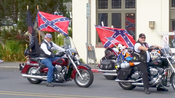 Two members of the American Legion Riders attached Confederate flags to their motorcycles for the Whidbey Island Fair parade on Saturday. The display provoked ire from several observers.