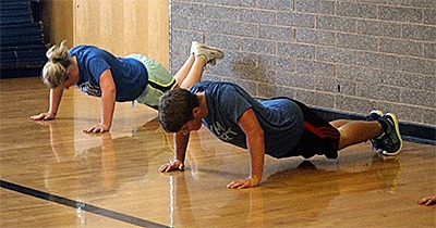 Coupeville athletes do pushups during a recent SST workout.