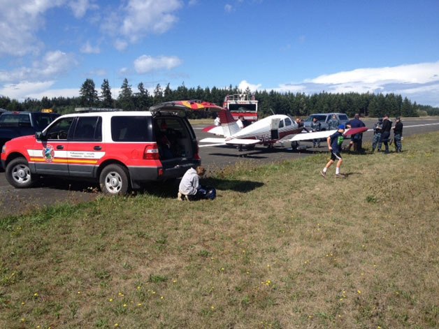 Central Whidbey Fire & Rescue responds to an emergency landing at the Naval Outlying Field near Coupevllle Wednesday.
