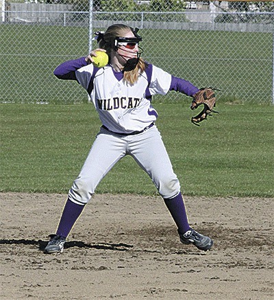 Oak Harbor second baseman Kelly Findley tosses to first for an out Friday.
