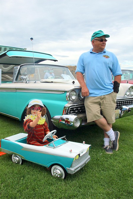 Jack Bittner of Bellingham stands in front of his 1959 Ford Galaxie/Skyliner. A doll named Nellie has her own version of the classic car.