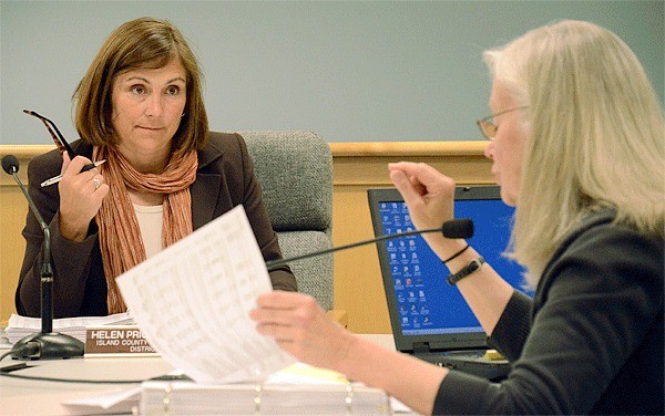 Island County Commissioner Helen Price Johnson listens as Budget Director Elaine Marlow talks about the cost of police patrol cars at a budget workshop last week.