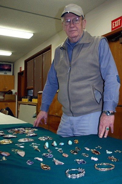 Dick James displays a number of the jewelry