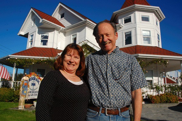 Dianne and Dave Binder stand before their Coupeville inn