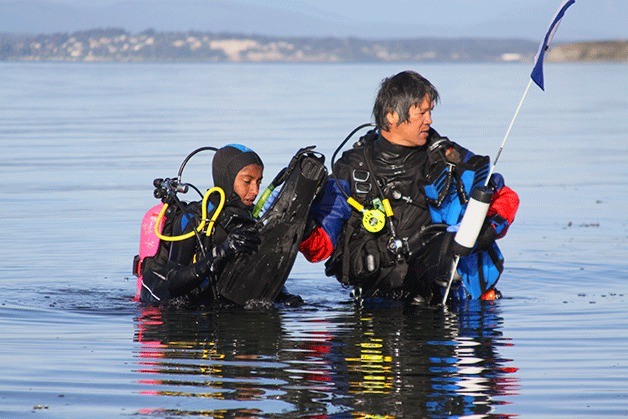 Salmon fishermen along the shores of Keystone beach in Coupeville Tuesday morning were surprised when divers from Walla Walla University surfaced  in front of them. Coho salmon fishing opened July 1 on the west side of Whidbey Island.