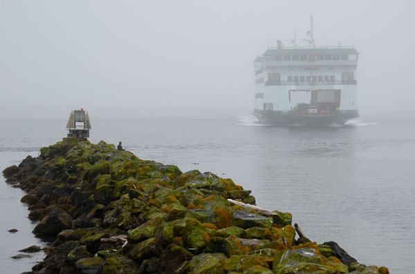 The MV Kennewick sails through morning fog into Keystone Harbor Friday. A recent meeting with ferry officials and legislators resulted in several changes for the new boats.