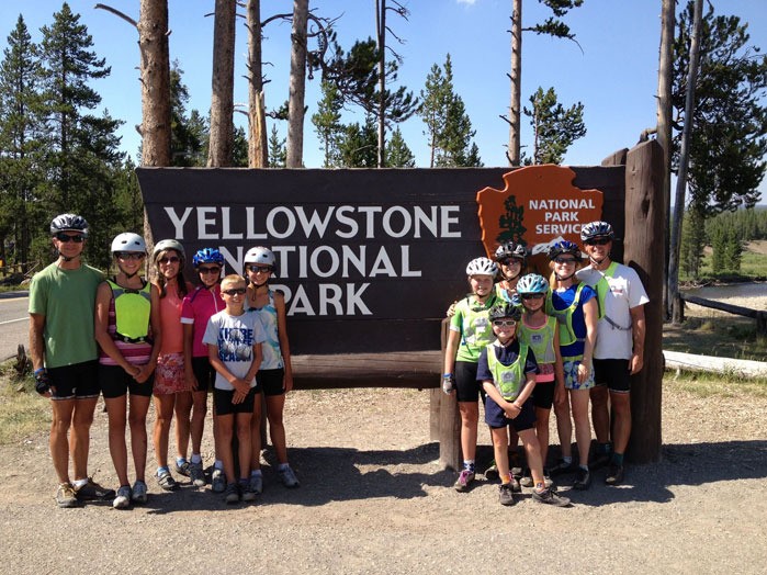 The Schroeder and Halvorson families enjoy a stop at Yellowstone National Park as they bicycle across the United States.