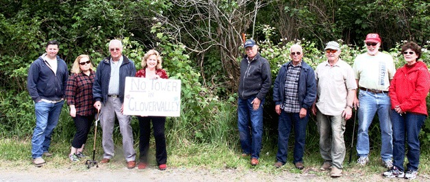 Neighbors in the vicinity of Thunder Lane and West Clover Valley Road in Oak Harbor gather near the site of a planned 120-foot cell tower. From left: Jason Sakash