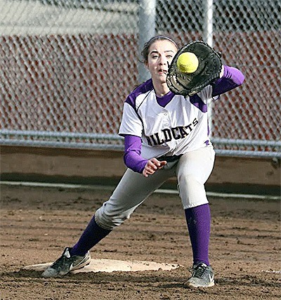 Taylor Heidt snares a throw at first base to force a Stanwood runner Friday. Heidt also collected three this for the Wildcats.