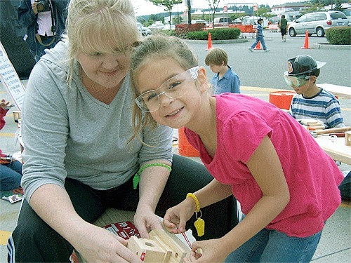 Megan Croft builds a helicopter with Ella Bradley at a previous Home Depot Fire Safety event. The workshop will be offered again at this year’s event on Saturday