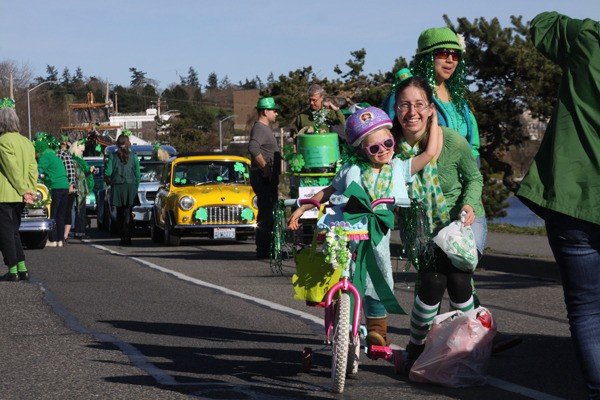 Paradegoers dressed festively in green lined much of Pioneer Way to cheer on the entries.