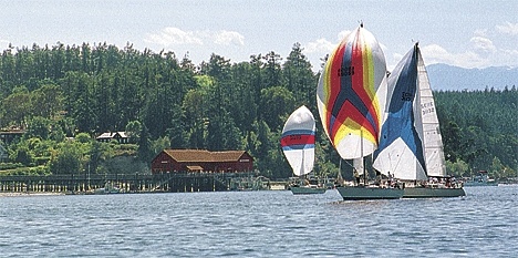 Colorful Race Week participants sail past the Coupeville Wharf in competition several years ago. The 2009 version of Whidbey Island Race Week will take place July 12-17 in Oak Harbor.