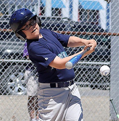 Austen Dearing smacks the ball in the Challenger game Sunday.