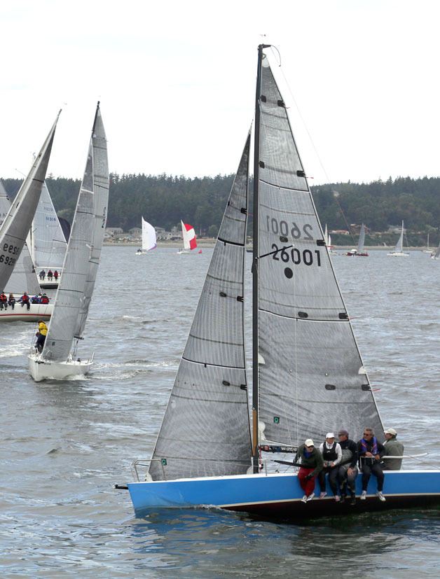 Sailors glide by the Coupeville Wharf during last year’s Whidbey Island Race Week.