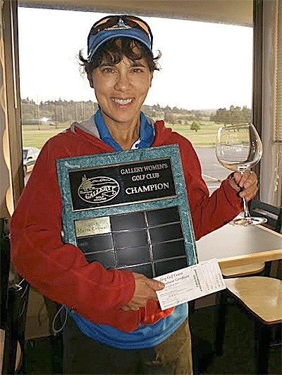 Maria Crowell holds her awards for winning the 2014 GWGC championship.