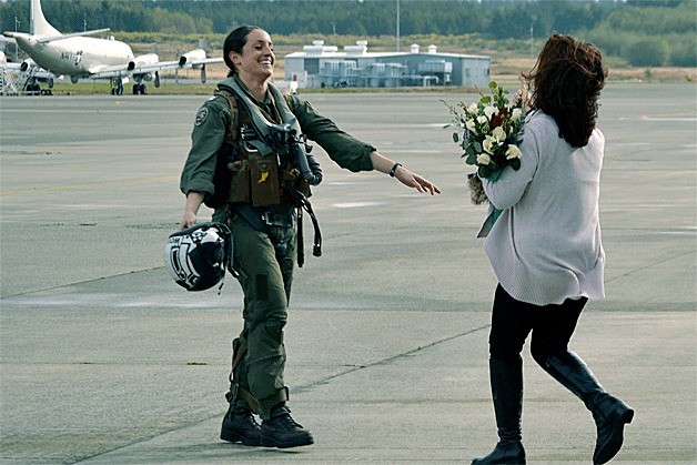 Patricia Schussler runs to meet her daughter