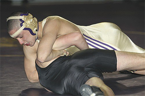 Ryuta Meany turns Lynnwood's Jake Latimere on the way to a fall in Oak Harbor's win.