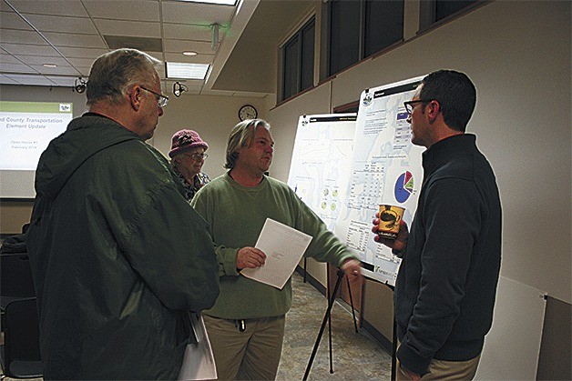 Tim Verschuyl and Garrett Newkirk discuss the county’s various transportation elements at  one of last week’s public meeting. A third meeting will be held on Camano Island Thursday night.