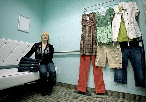 Maurices’ manager Linda Roberts shows off one of the clothing store’s new dressing rooms