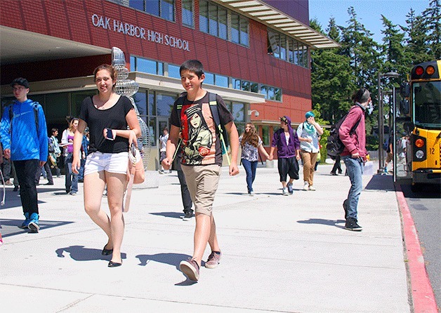 Students from Oak Harbor High School depart for the day Thursday after school was dismissed. Oak Harbor Public Schools is facing uncertainty in the future over how much student populations might be impacted by potential growth on the naval base.