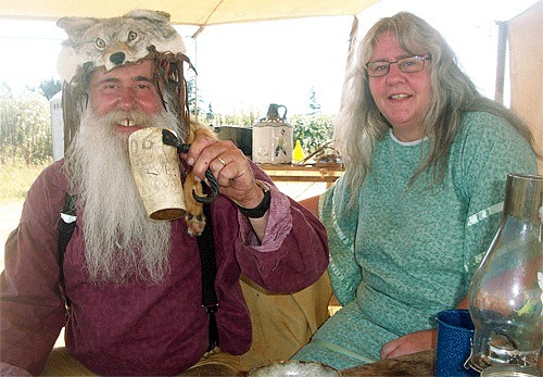 Rabbi (Dave Hollett) and wife Rope Cutter (Tammy Hollett) make themselves at home in their Mountain Man tent set up for Rendezvous Days this weekend just south of Coupeville.