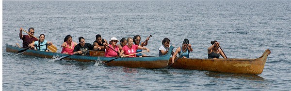 Women in the six-person canoe race compete neck and neck toward the Coupeville Wharf during a race Saturday at the  19th annual Penn Cove Water Festival.