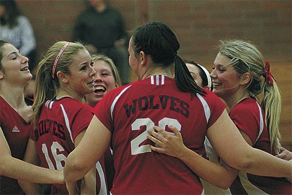 The Coupeville volleyball team is all smiles after a successful kill against South Whidbey. From left