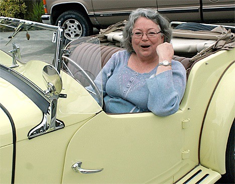 Barn Rally organizer and Coupeville resident Jackie Feusier sits in her 1953 MG. The Barn Rally takes place Saturday starting in Coupeville.