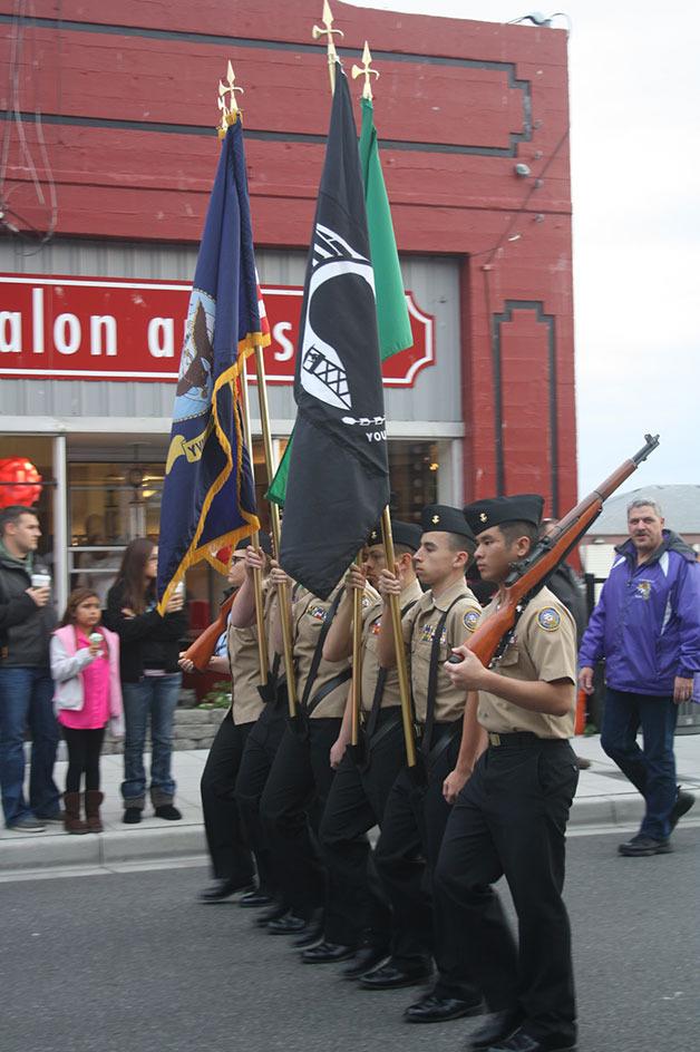 The NJROTC color guard marches in the homecoming parade. The guard will take part in Tuesday’s Veterans Day program.