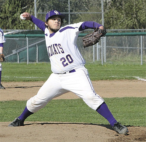 Danny Wolfe fires a pitch against Stanwood Wednesday. Wolfe pitched a three-hitter in the Wildcat win.