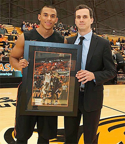 Mike Washington Jr. is honored by coach Mitch Hendersen on Princeton's Senior Night.