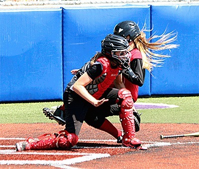 Whidbey catcher Patti Miessner takes out a Skagit runner at the plate for the final out of the game Saturday.