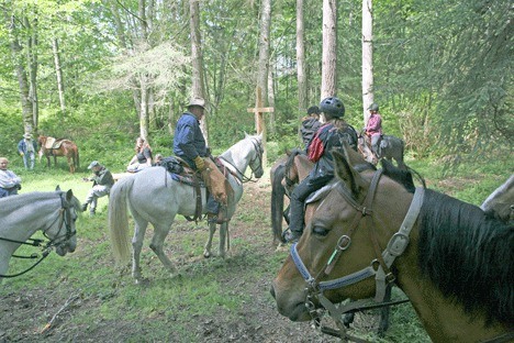 Equestrians tour Trillium Woods earlier this summer. The 664 acres of land will be secured for public use when the Whidbey Camano Land Trust reaches its $4.2 million goal