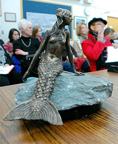 A miniature version of a bronze mermaid that may end up decorating Pioneer Way sits on display at one of several Arts Commission meetings held over the past few months.