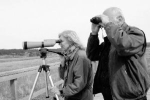 Cheryl and Bill Bradkin scope out the birds at Keytone. The Bradkins are active Audubon members who often lead the popular birding field trips organizaed by Whidbey Audubon.