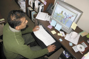 Oak Harbor Senior Planner Cac Kamak works on the city blog for its 2008 comprehensive plan. Kamak and fellow senior planner