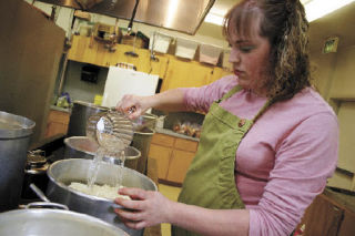 Sarah Nienhuis was among the crew of volunteers busy preparing for Friday evening’s Dutch dinner at the First Reformed Church. The annual dinner that kicks off Holland Happening takes two weeks of preparation and 50 volunteers to produce.